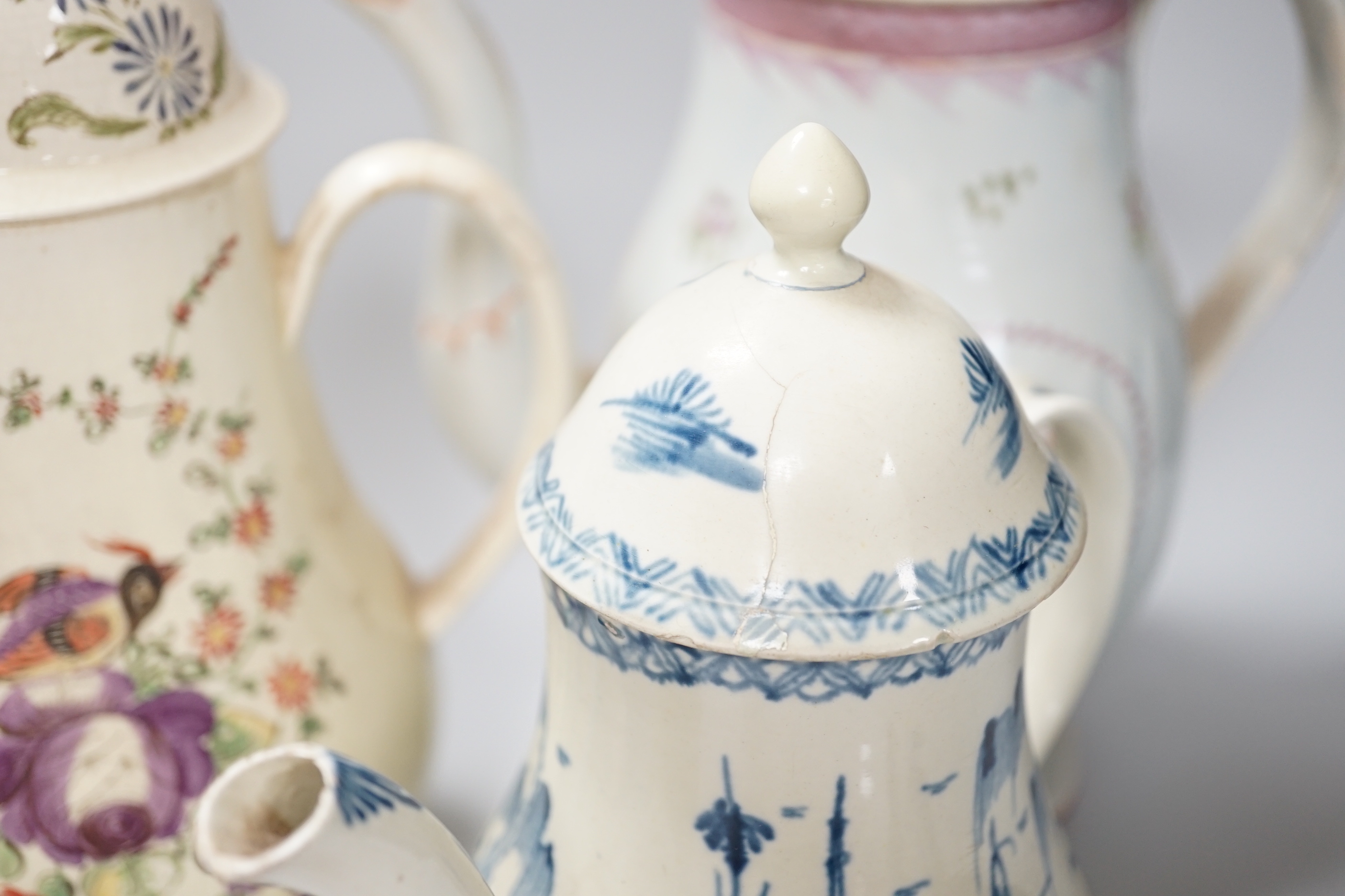 Three Georgian creamware and pearlware teapots, a jug and a mug, tallest 27cm